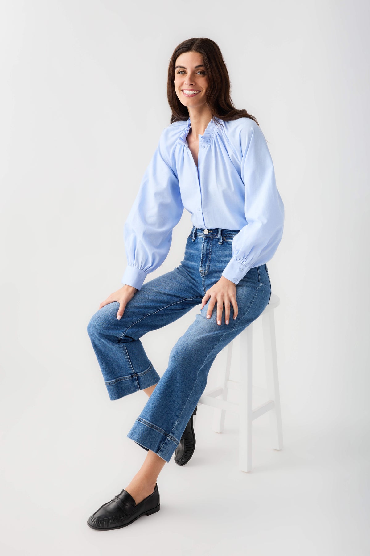 Medium-wash wide-hem ankle jeans with button fly, belt loops, and cuffed wide hems