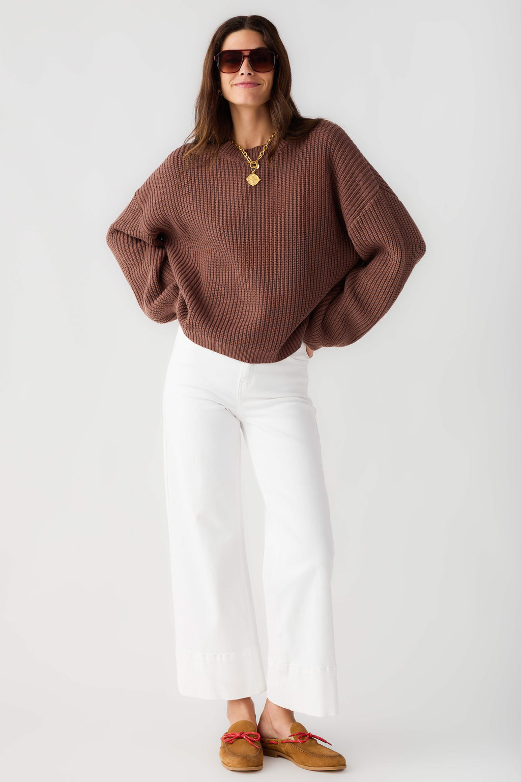 Chocolate knit pullover top with ribbed crew neck and long loose sleeves