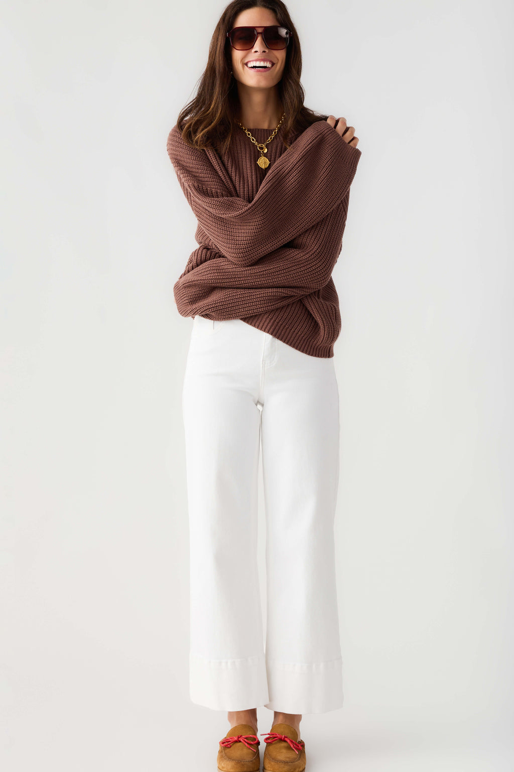 Chocolate ribbed knit pullover top with crew neck and draped long sleeves