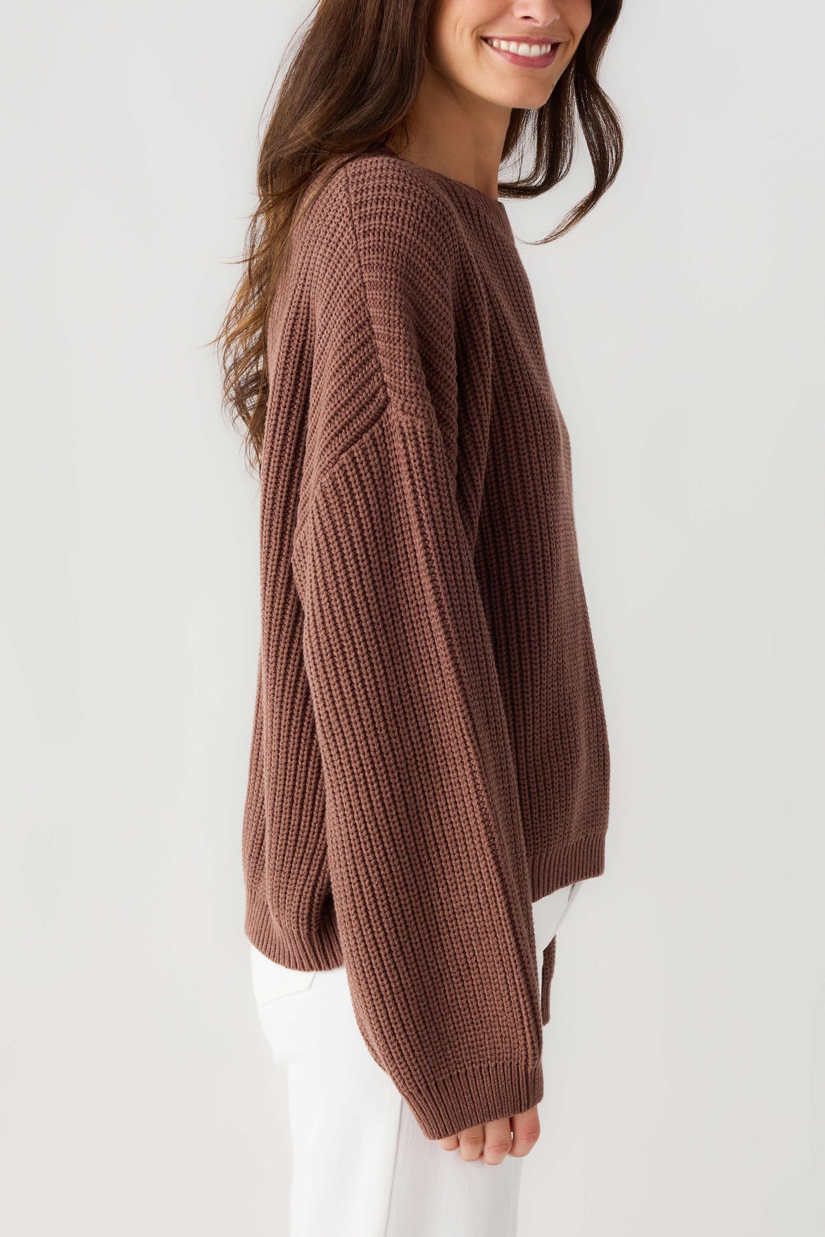 Chocolate knit pullover top, side view with ribbed knit texture and long sleeves