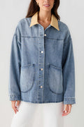 Light blue denim jacket front with tan corduroy collar, chest pockets and button placket