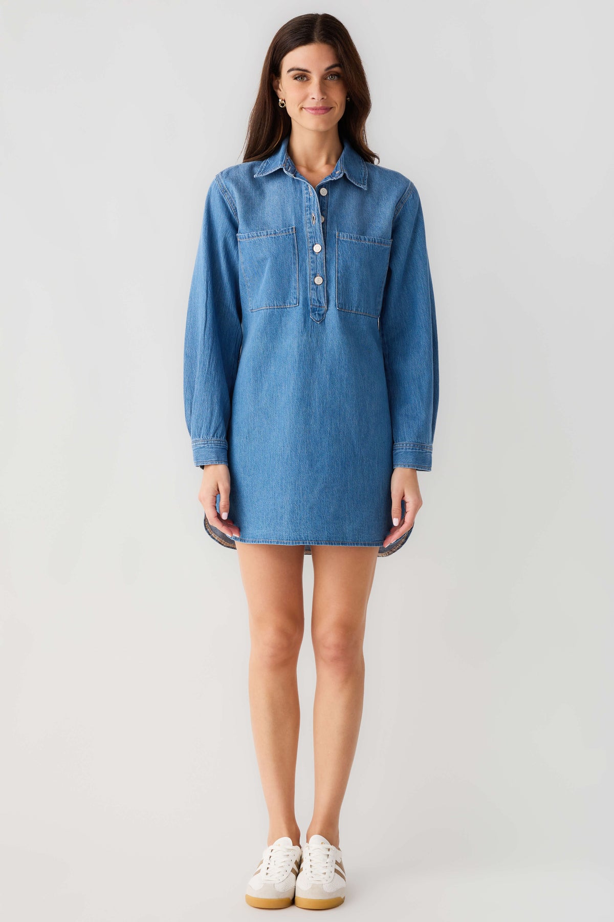 Blue denim shirt dress with point collar, button front and chest pocket, long sleeves.