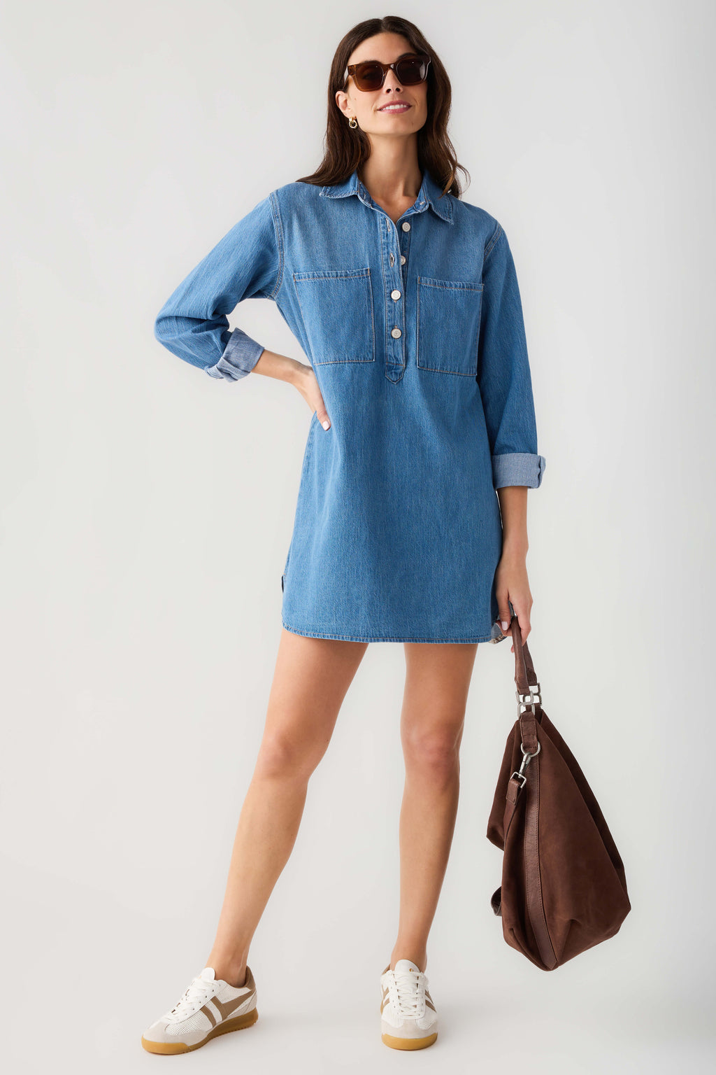 Blue denim shirt dress with point collar, button front and chest pockets.