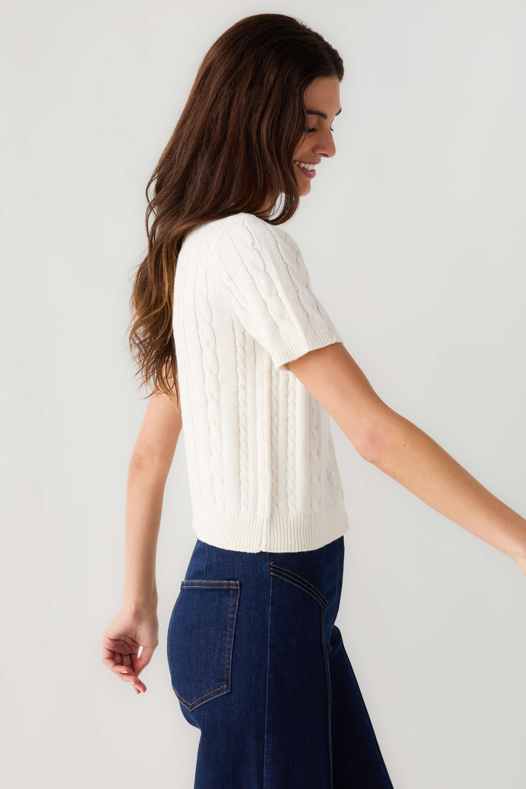 Off-white cable-knit short-sleeve cardigan, side profile