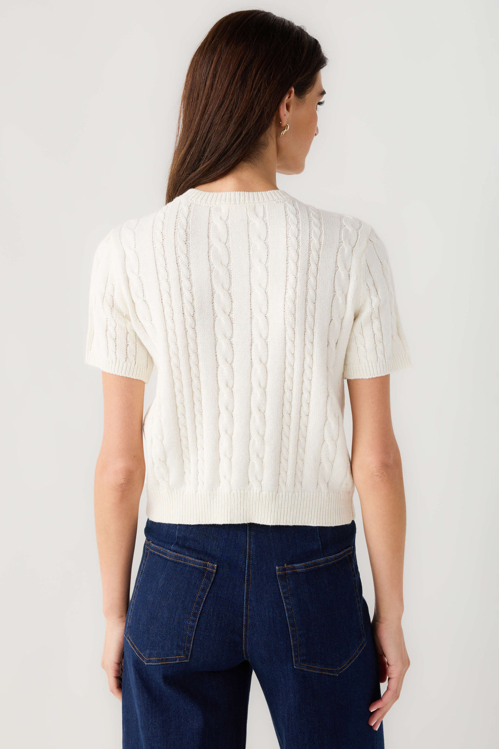 Off-white cable-knit short-sleeve cardigan, back view with cable pattern