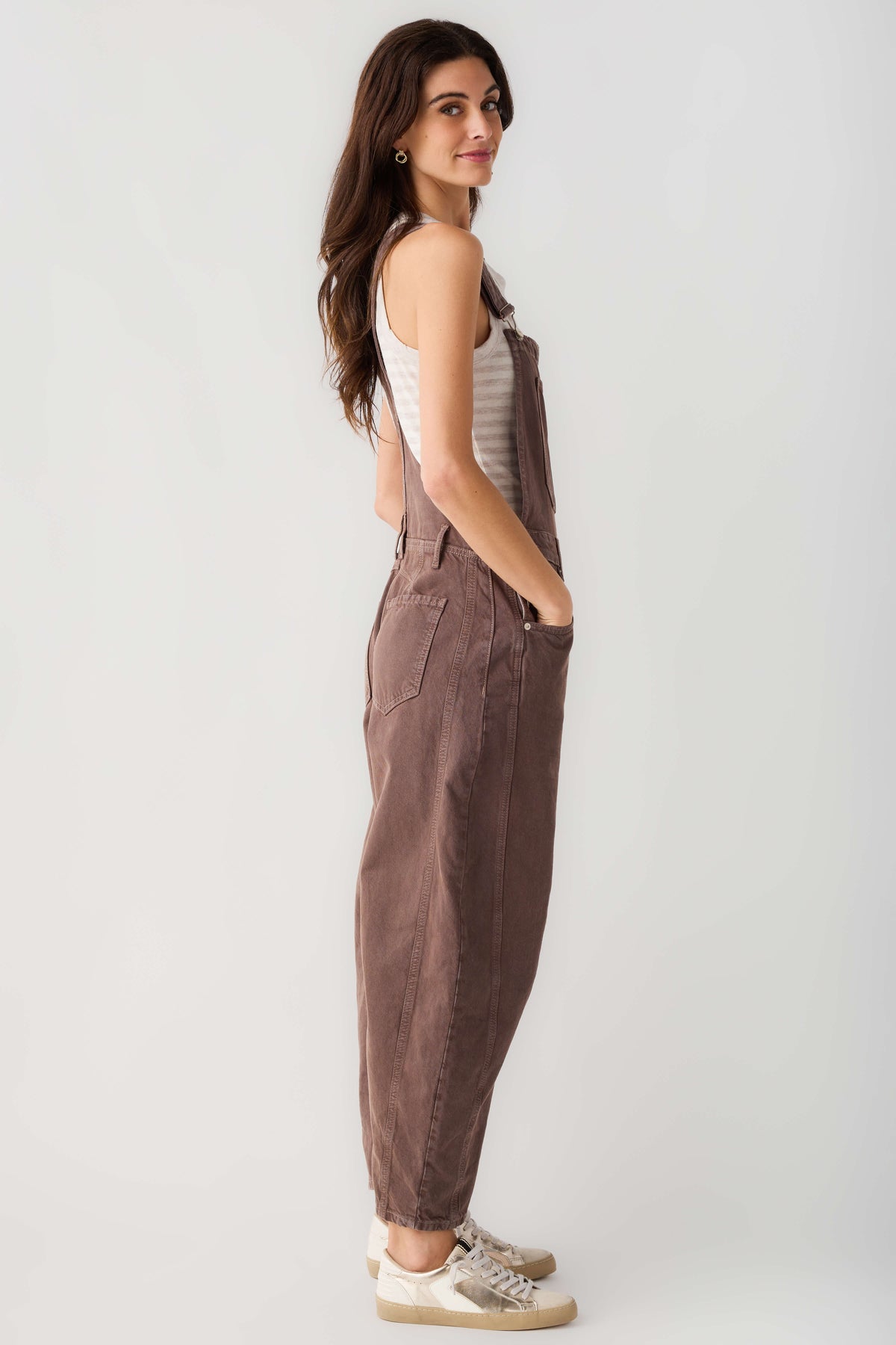 Chocolate brown denim overalls with bib front, adjustable straps, and relaxed wide legs