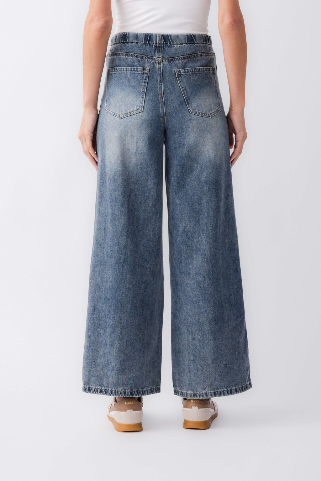 Wide-leg denim jeans with varsity stripe down each outer leg, drawstring waist