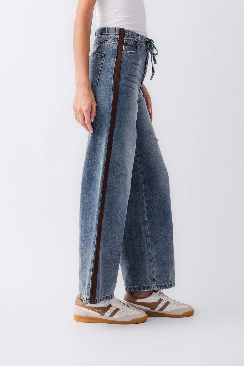 Wide-leg denim jeans with varsity side stripe and drawstring ties at the waistband