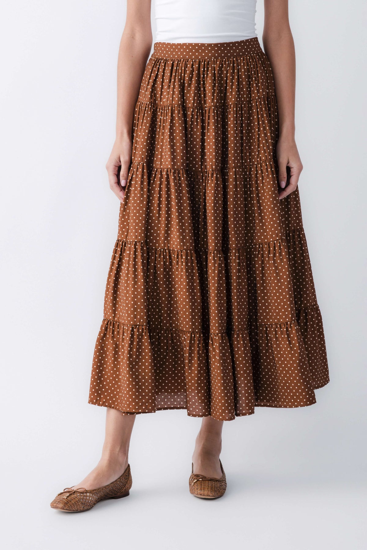 Brown polka-dot tiered maxi skirt with elastic waistband