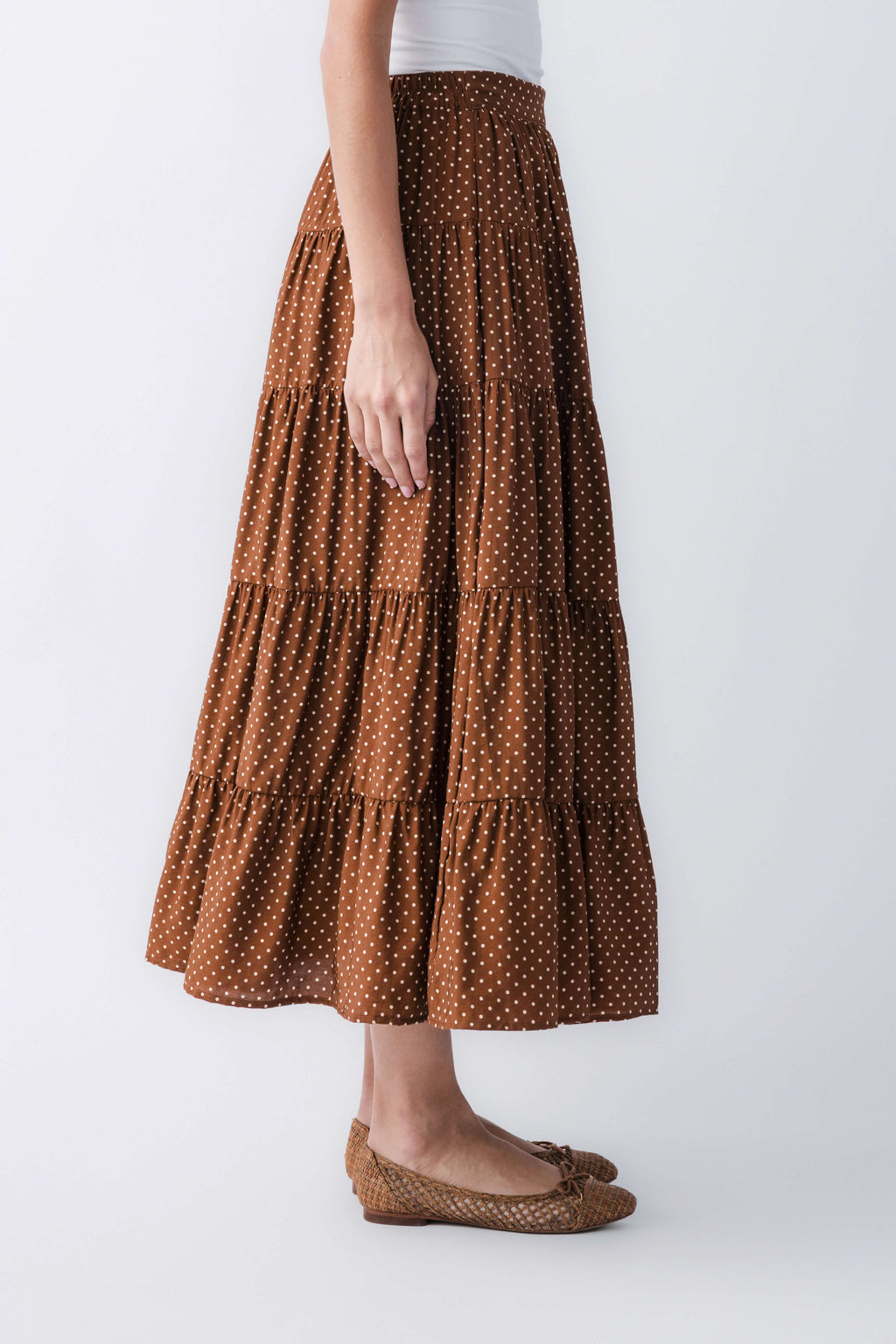 Brown polka-dot tiered maxi skirt with elastic waist and tiered hem