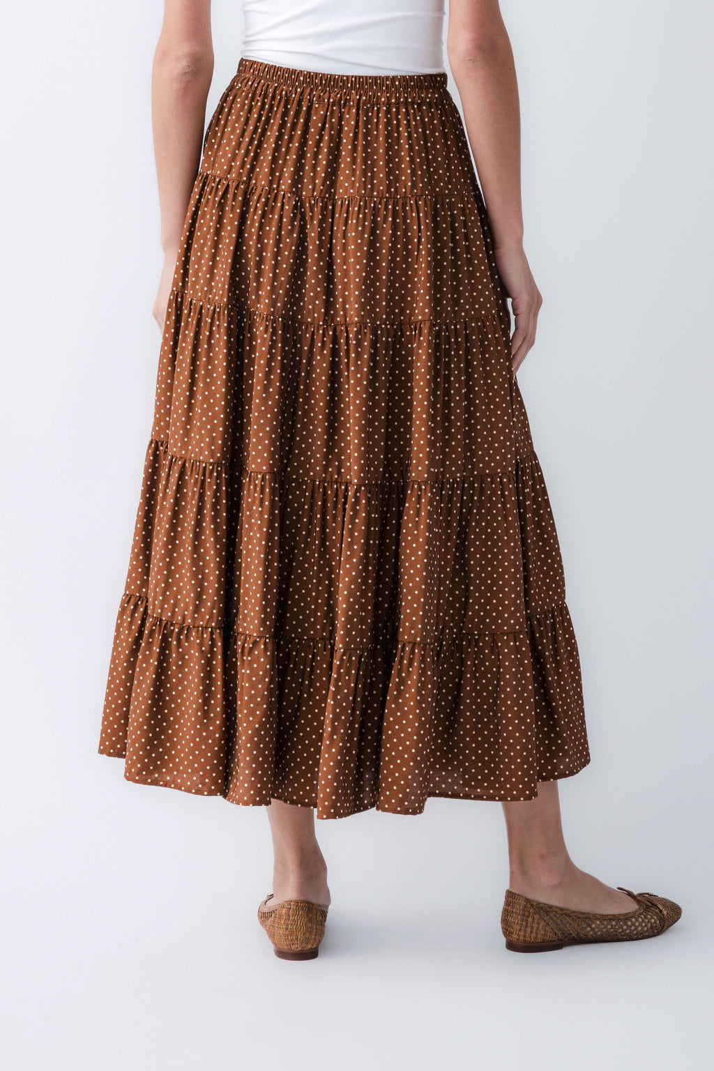 Brown polka-dot tiered maxi skirt with elastic waistband and layered tiers