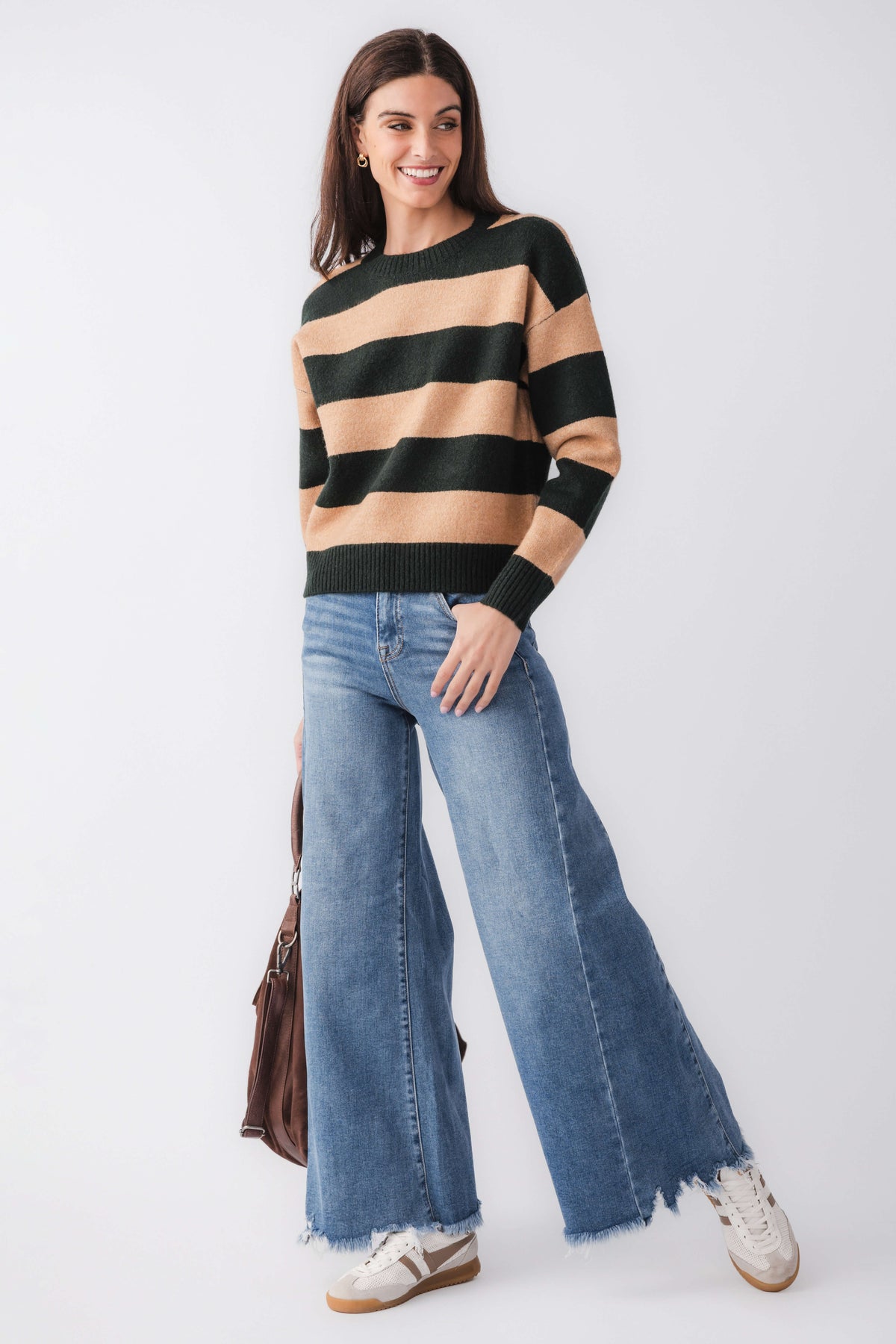 High-rise ultra wide leg jeans in medium wash denim, frayed hem, five-pocket style.