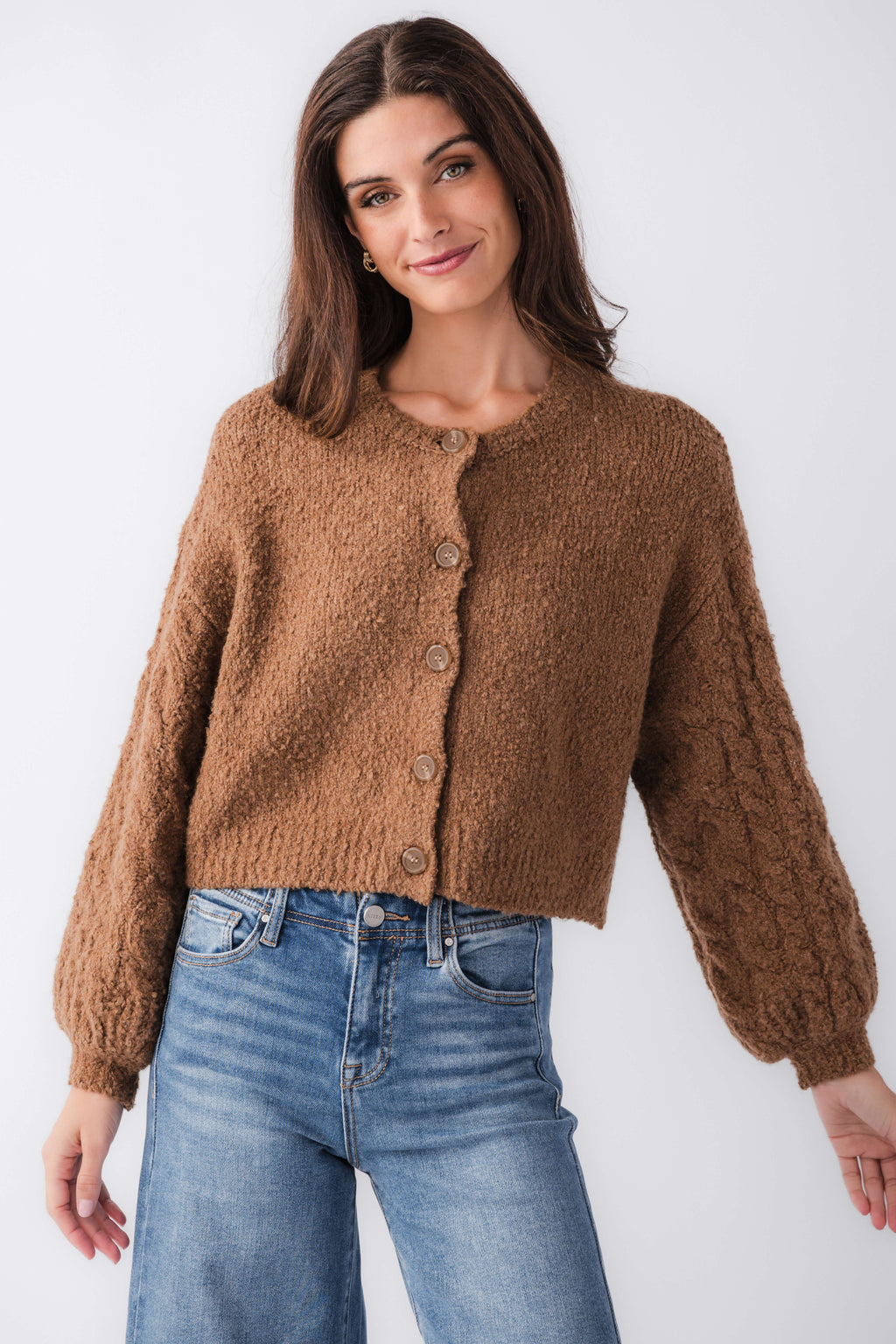 Brown cardigan with button front and long sleeves; cropped length