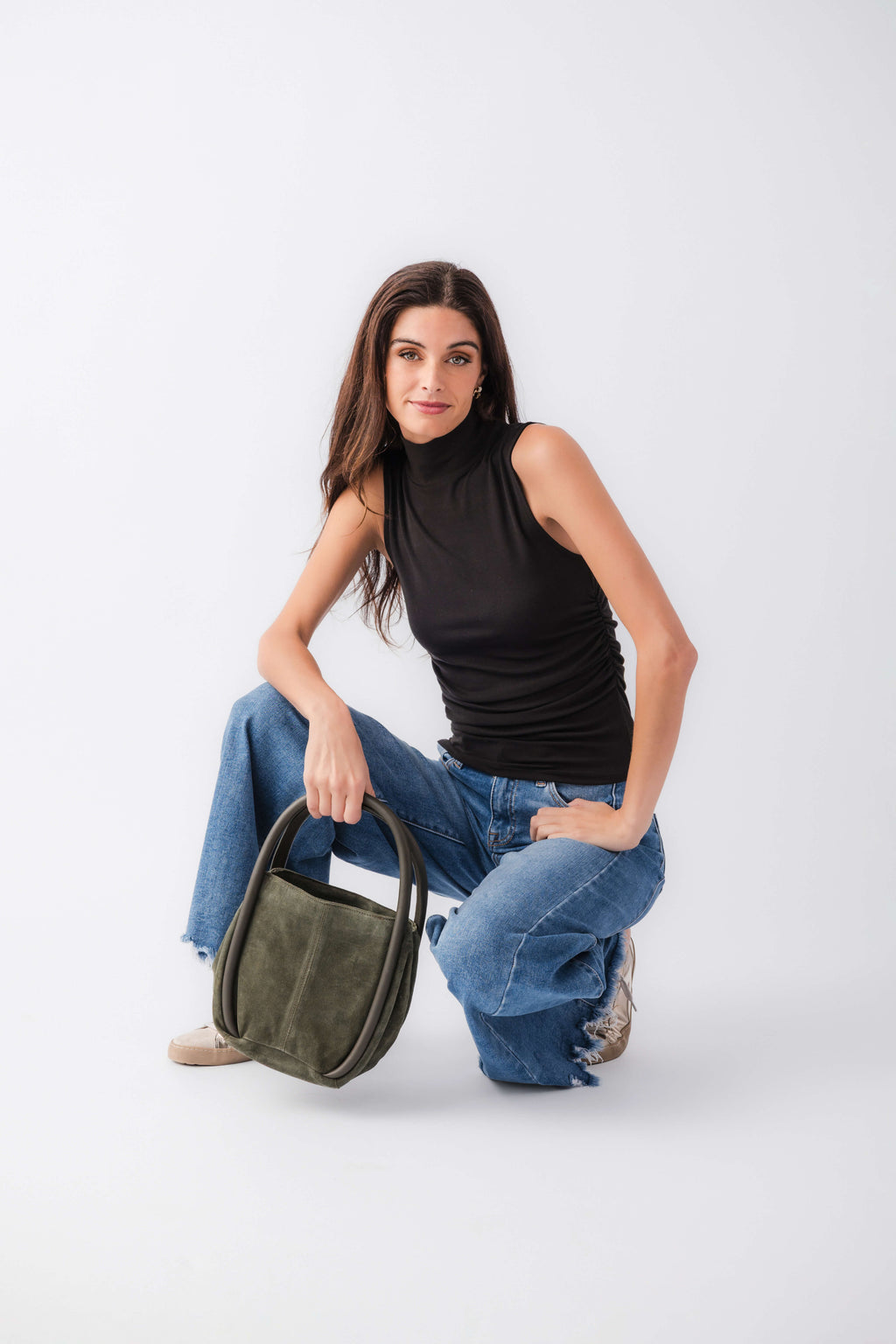 Black sleeveless high-neck tank top, fitted with smooth drape