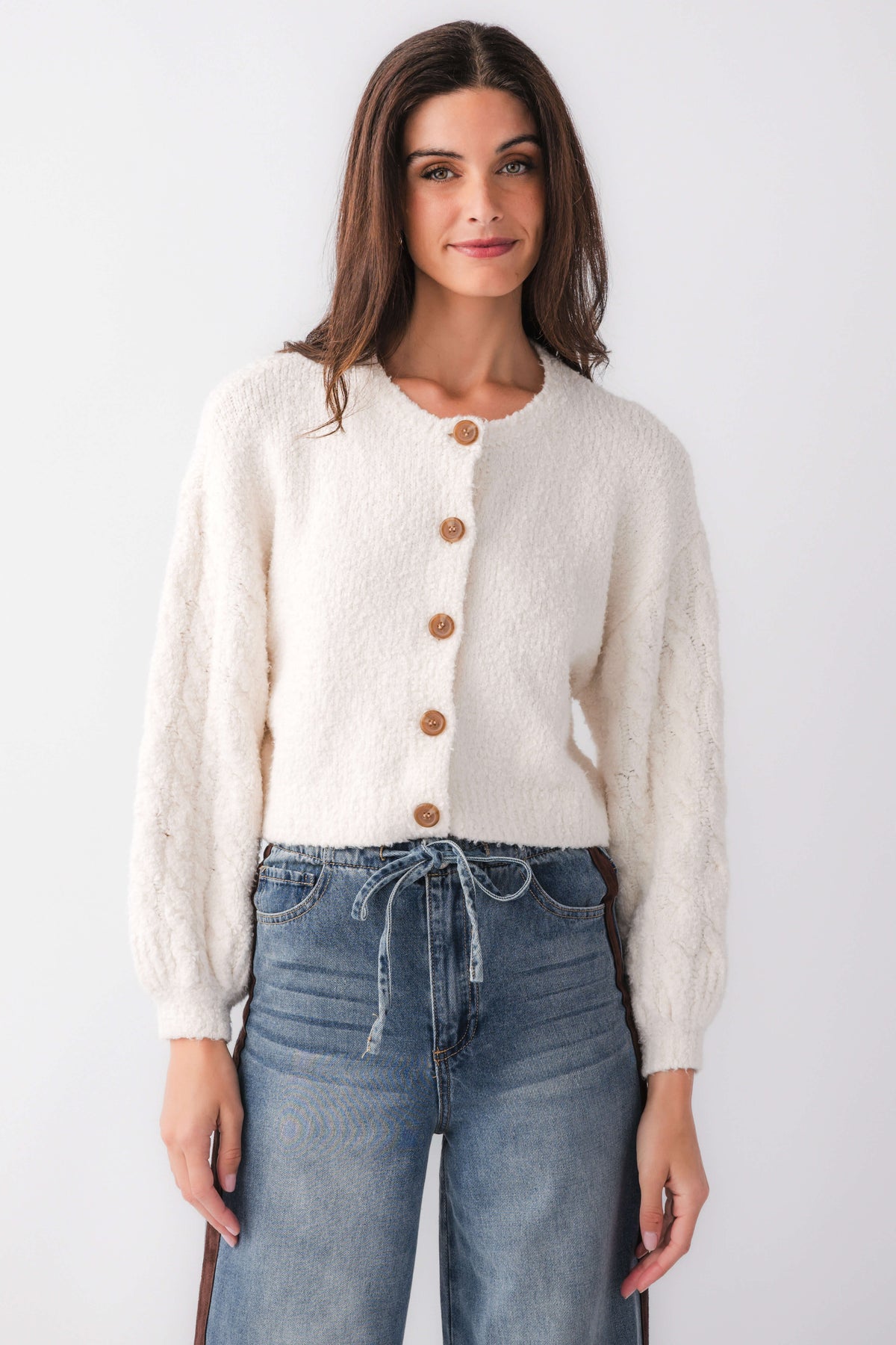 White fuzzy cardigan with button front and long sleeves