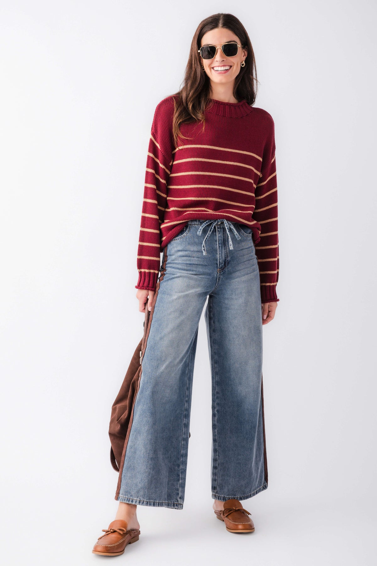Burgundy striped knit mockneck sweater with long sleeves and ribbed crew