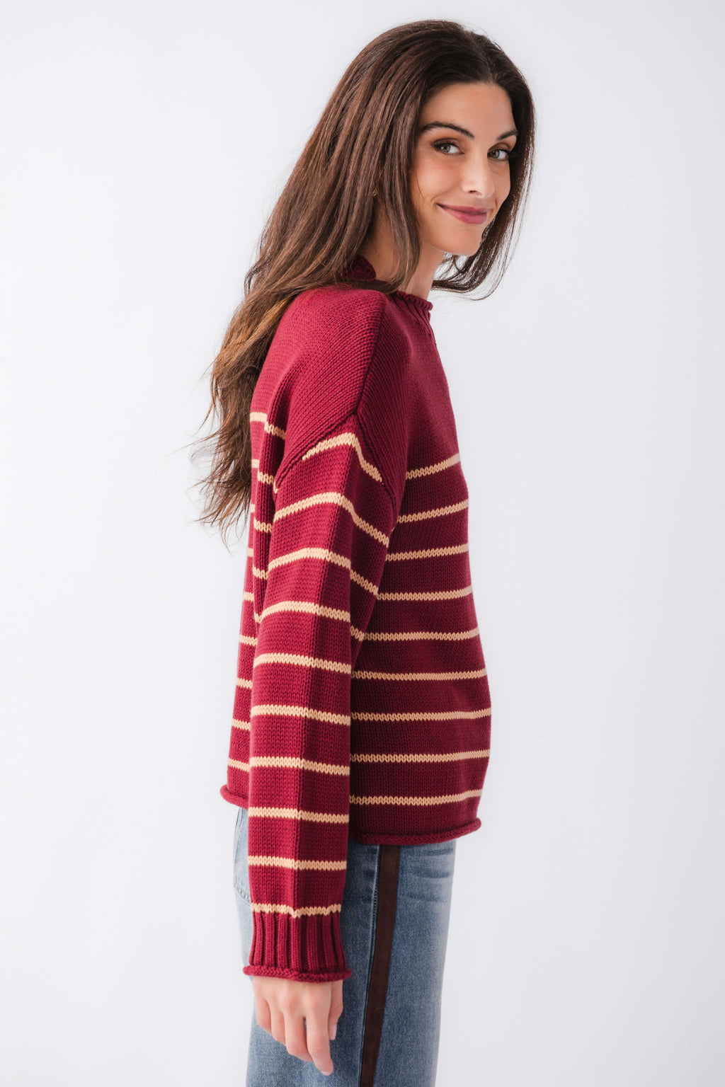 Burgundy striped knit mockneck sweater, side view with ribbed hem