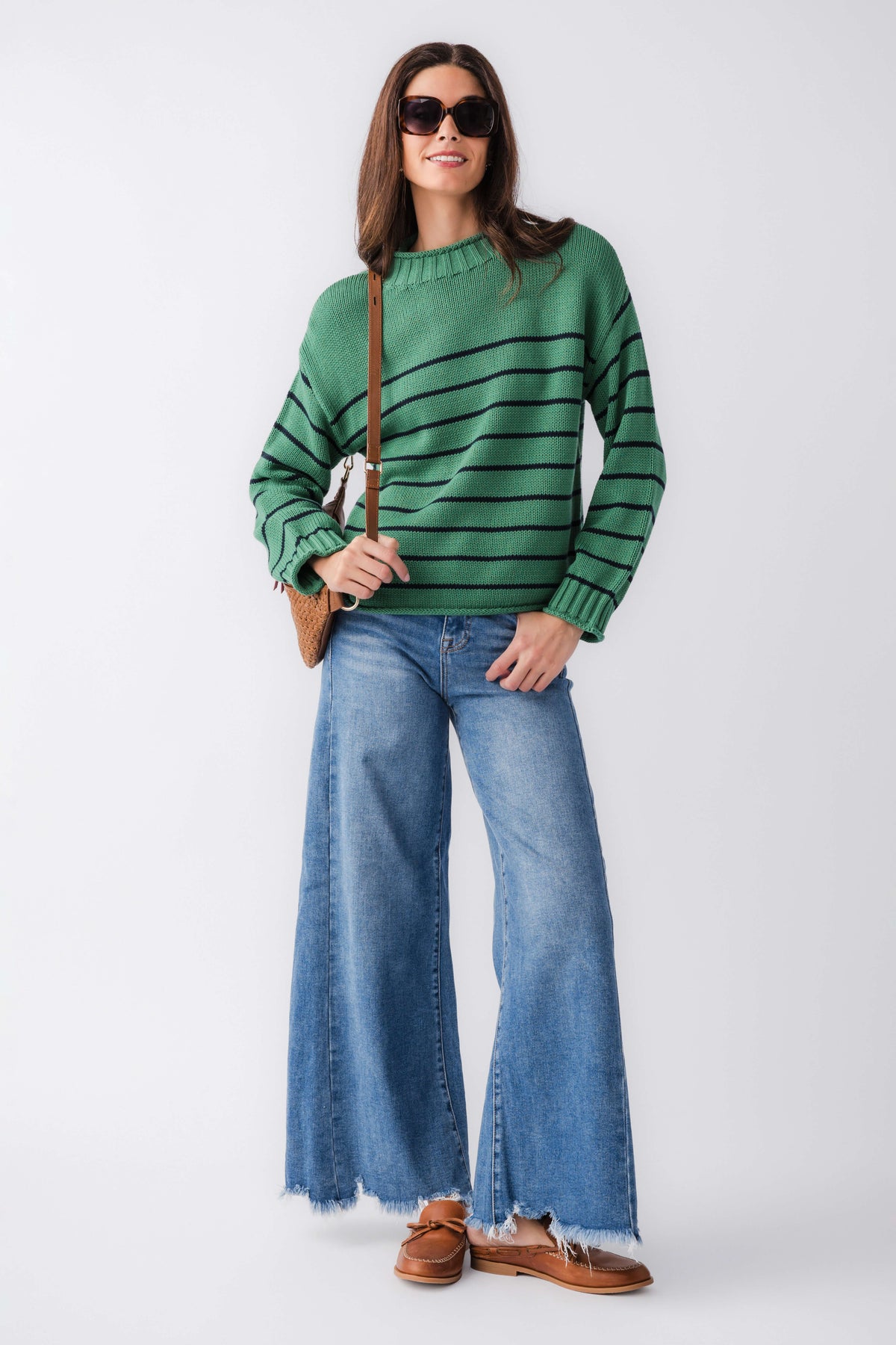 Green striped knit mockneck sweater with long sleeves and ribbed hem