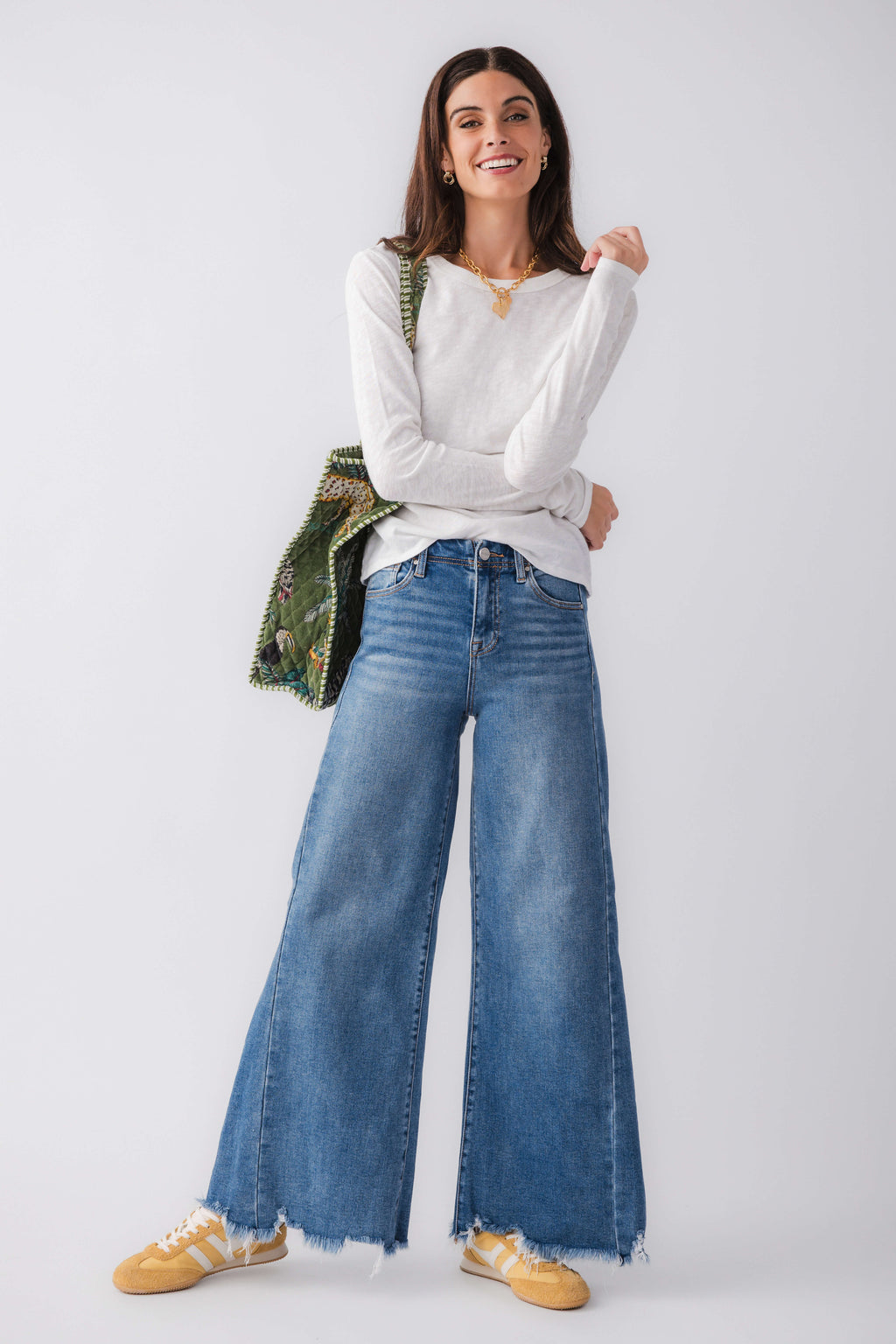 White long-sleeve crew neck tee with relaxed drape, full front view