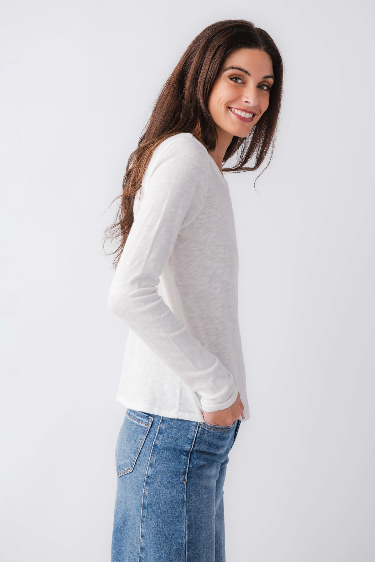 White long-sleeve tee with crew neck and fitted cuffs