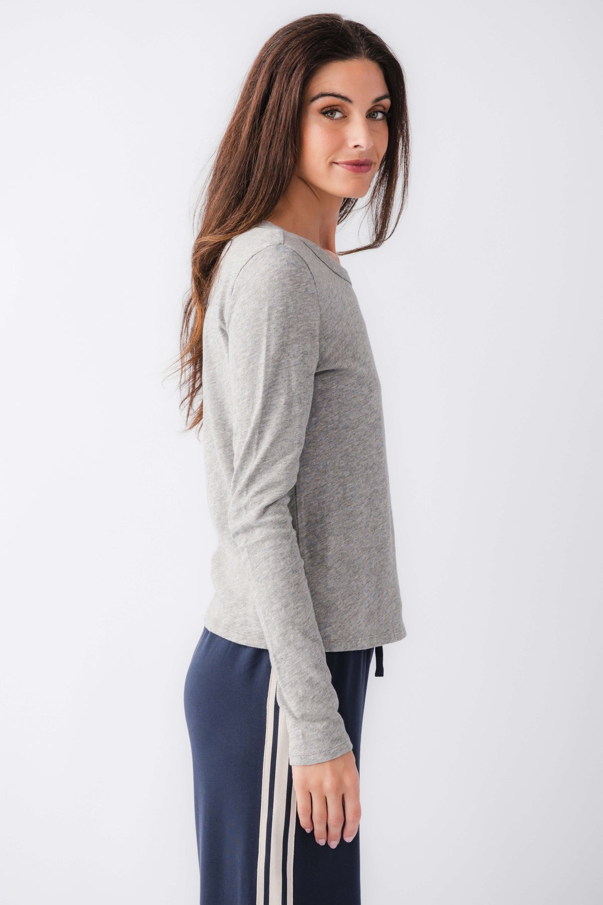 Heather grey long-sleeve crew neck tee, side profile view