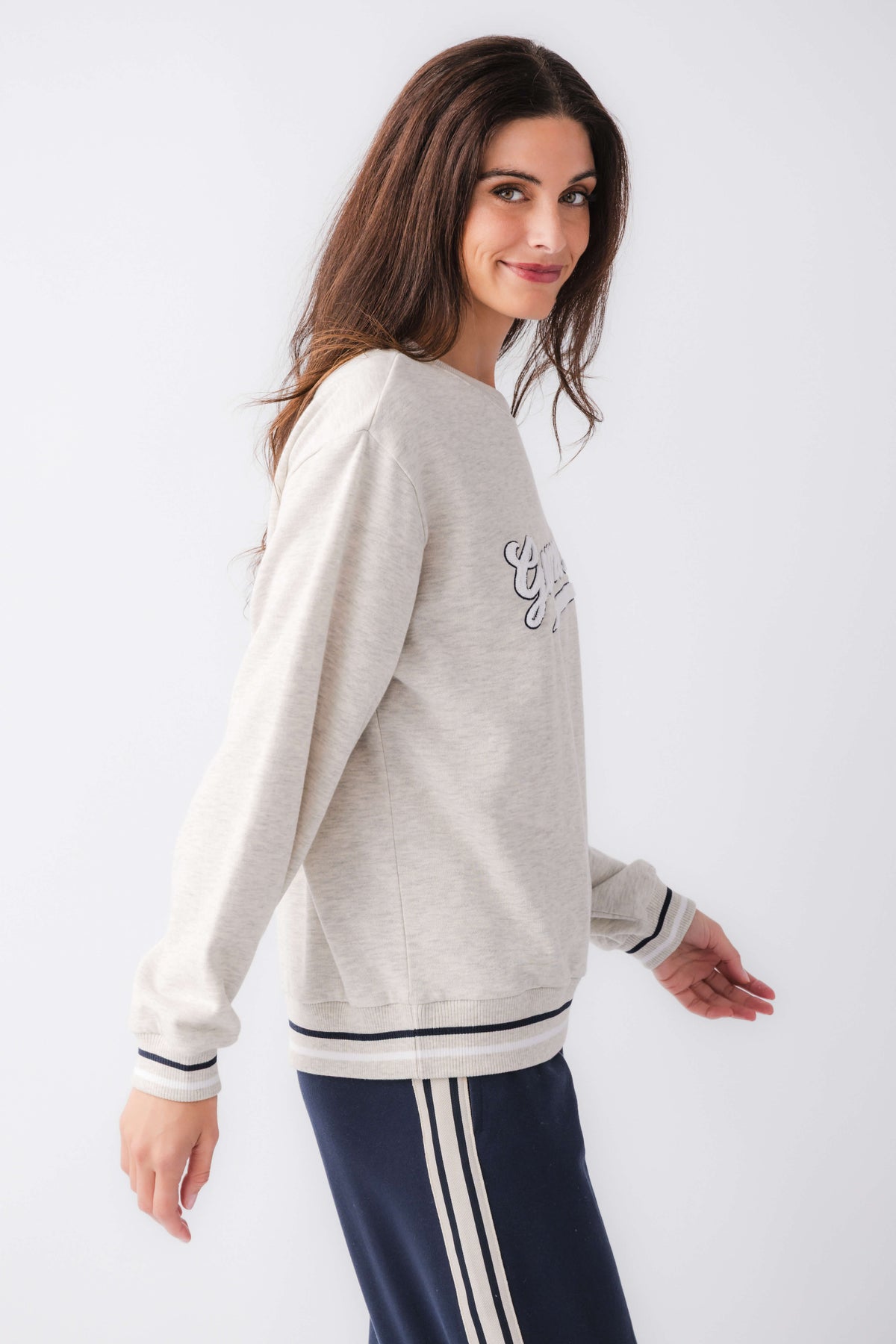 Light gray crewneck sweatshirt with 'Game Day' logo graphic, ribbed cuffs