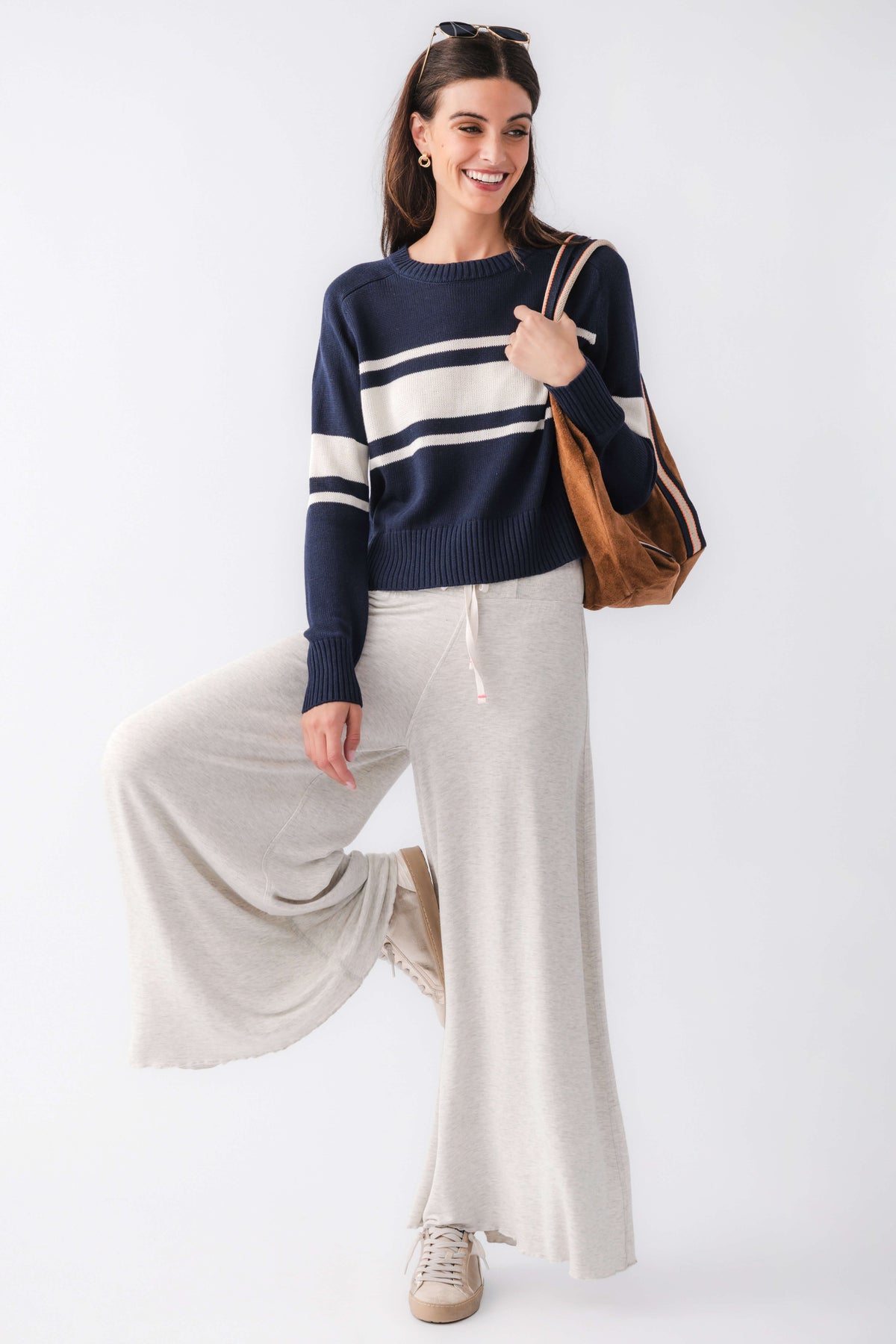 Navy crewneck knit sweater with cream horizontal stripes, long sleeves