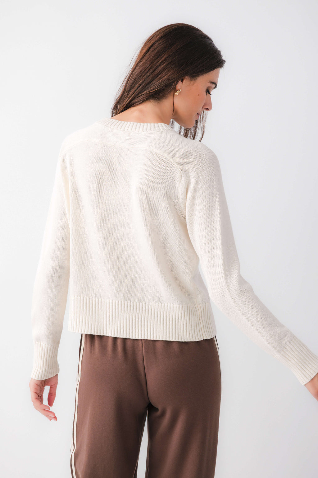 Cream crewneck sweater with ribbed hem and cuffs, back view
