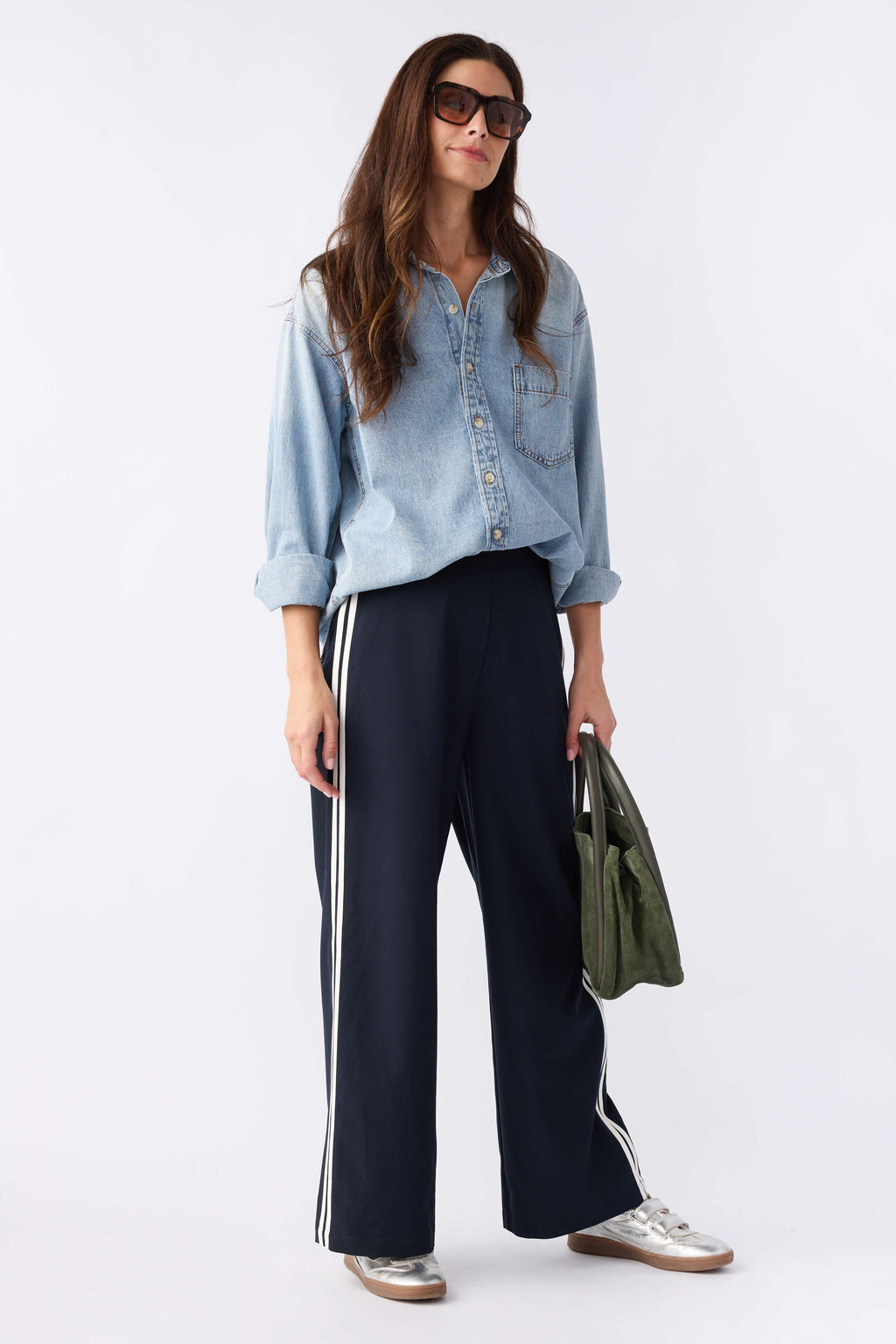 Navy pull-on track pants with white side stripes, wide-leg silhouette