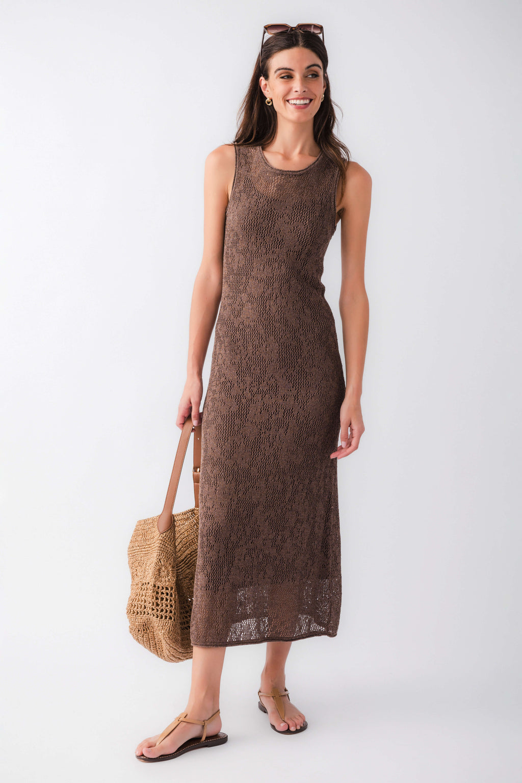Cocoa brown sleeveless midi dress, round neckline, textured fabric, side slit hem.