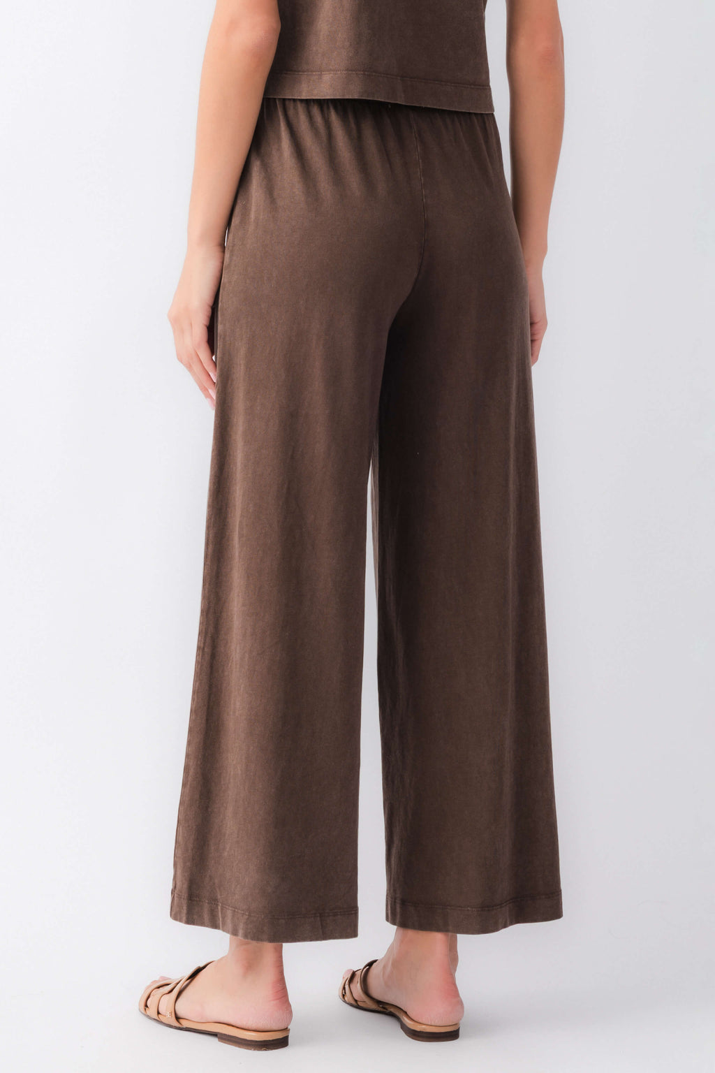 Dark brown jersey crop flare pants with elastic waist, wide legs