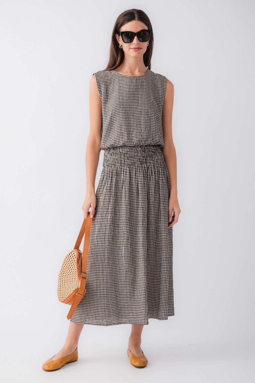 Black-and-white gingham midi skirt with elastic waistband and gathered A-line shape