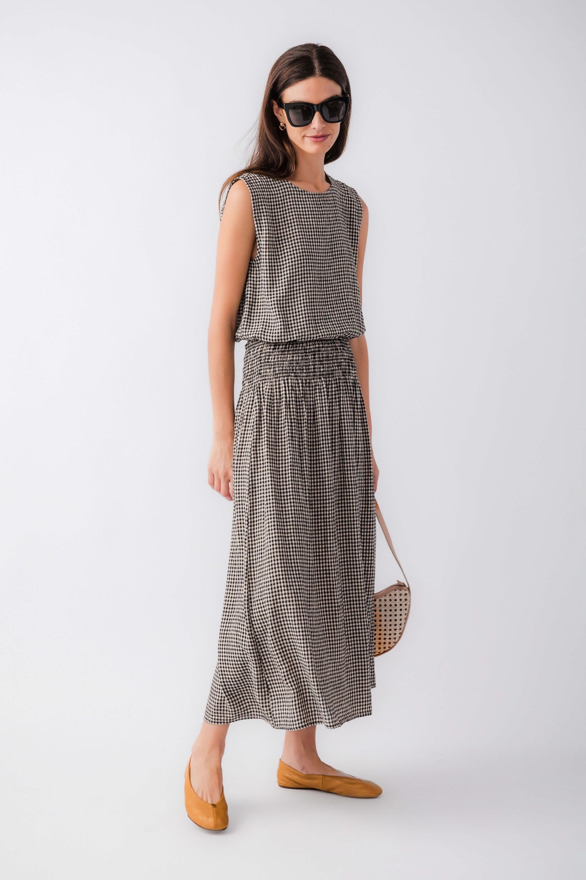 Black-and-white gingham midi skirt with elastic waistband and gathered skirt