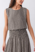 Sleeveless gingham top with crew neckline and gathered waist detail