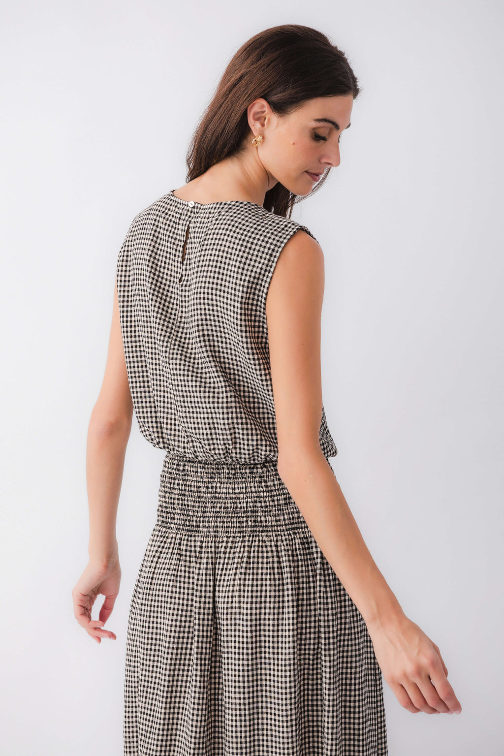 Back of gingham sleeveless top with gathered waist and crew neckline
