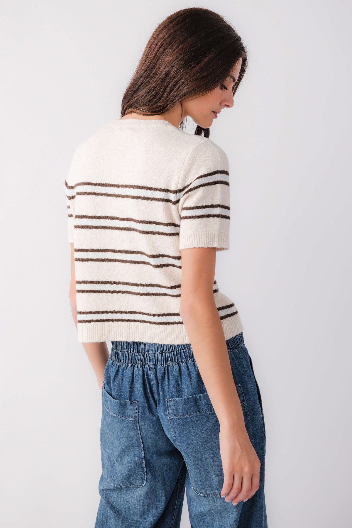 Light oatmeal heather striped knit sweater, short sleeves, back view with ribbed hem