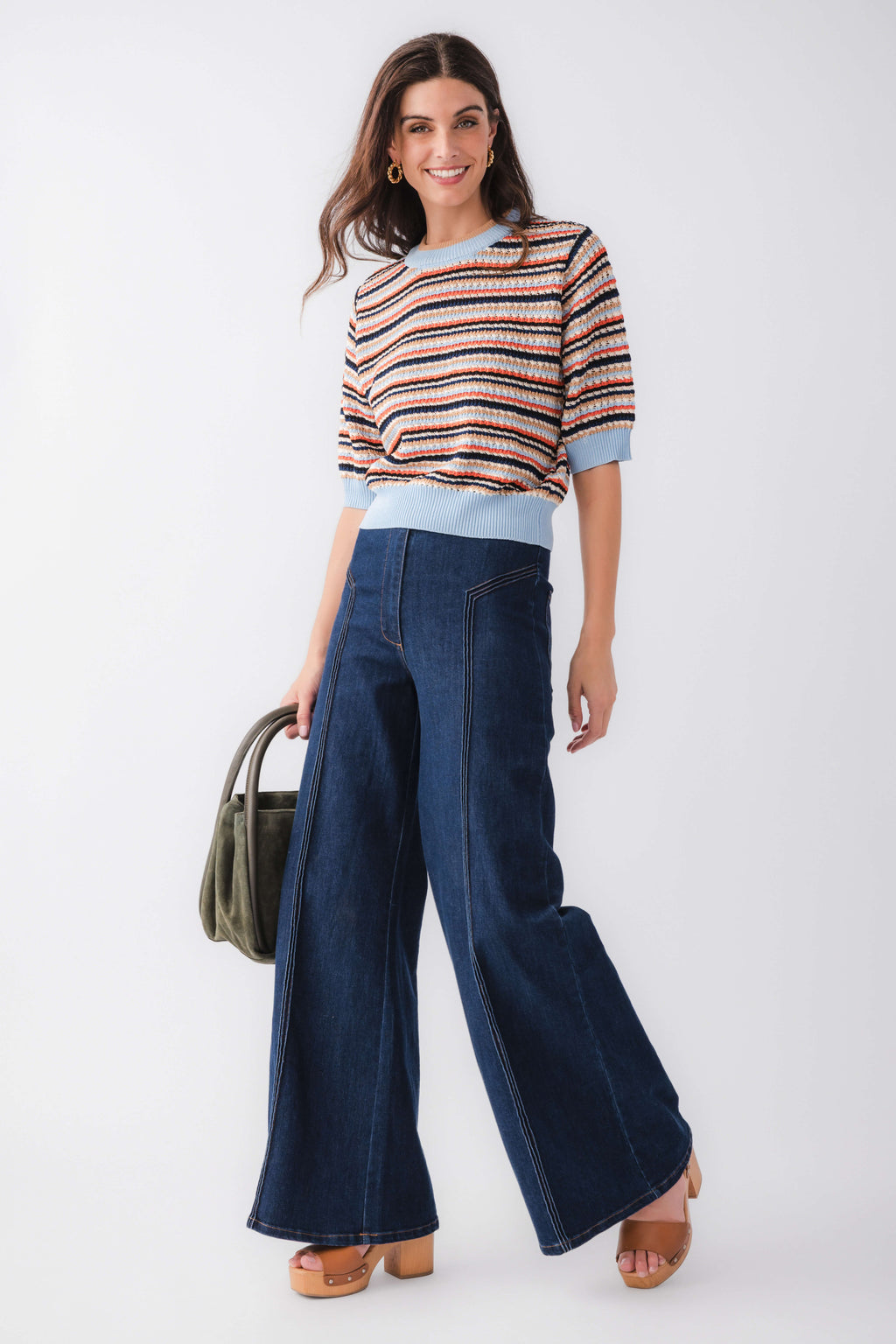 High-waisted dark denim flare pants with front patch pockets and wide flared hem
