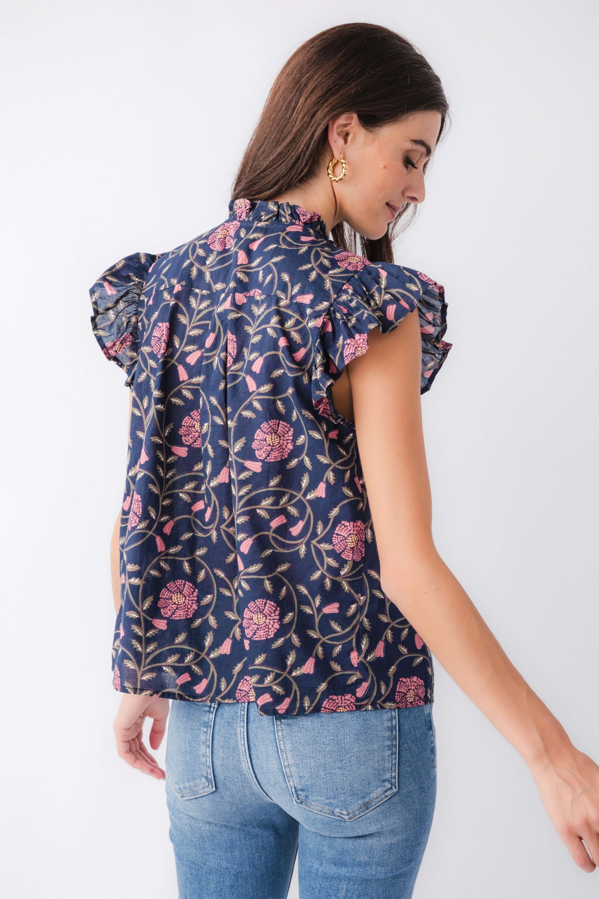 Navy floral block-print button-up top with flutter sleeves, back view