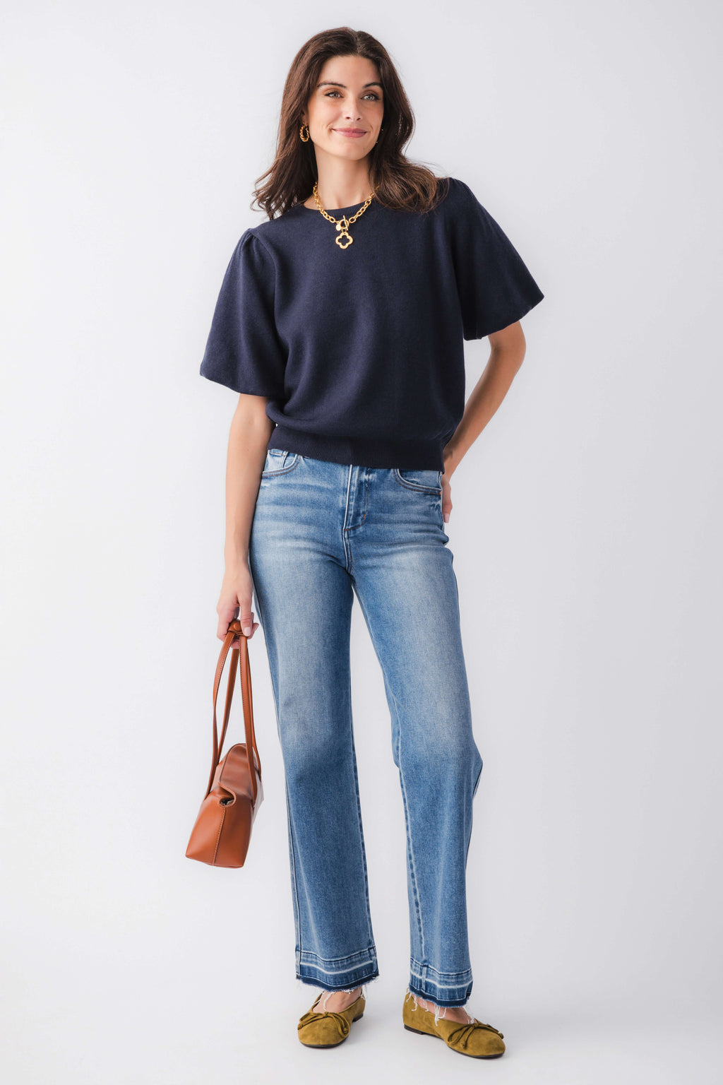 Medium-wash high-rise straight jeans with released hem, ankle length