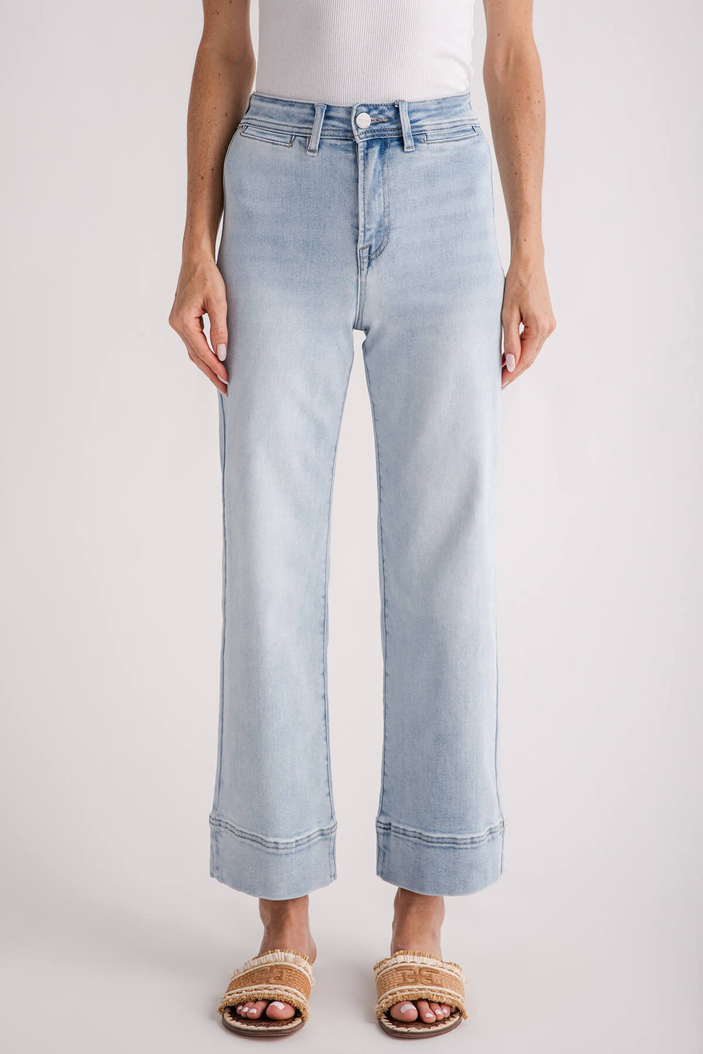 Light-wash wide-leg ankle jeans front view with button closure and stitched cuffs
