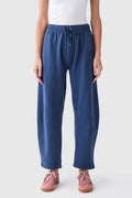 Blue elastic-waist drawstring pants with relaxed wide legs and front pockets