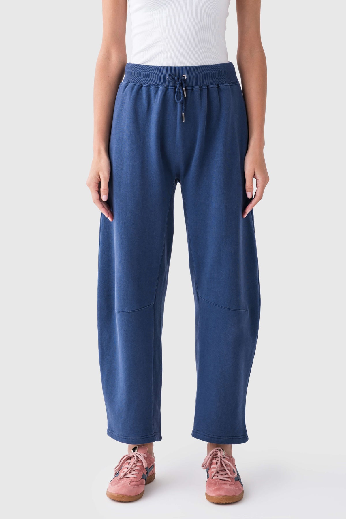 Blue elastic-waist drawstring pants with relaxed wide legs and front pockets
