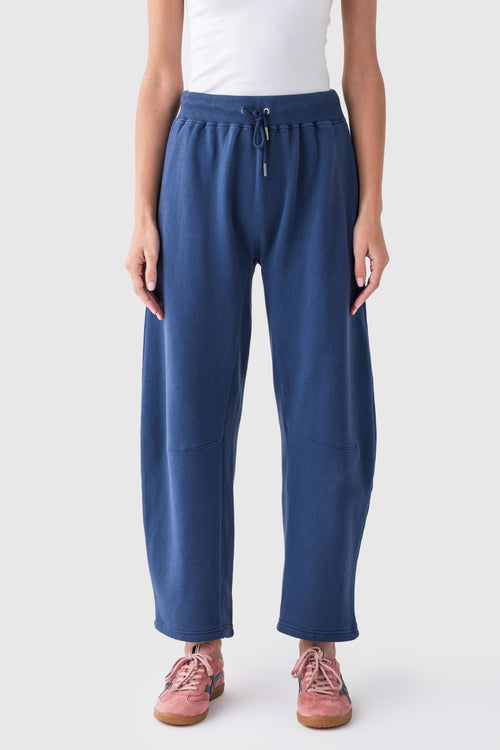 Blue elastic-waist drawstring pants with relaxed wide legs and front pockets
