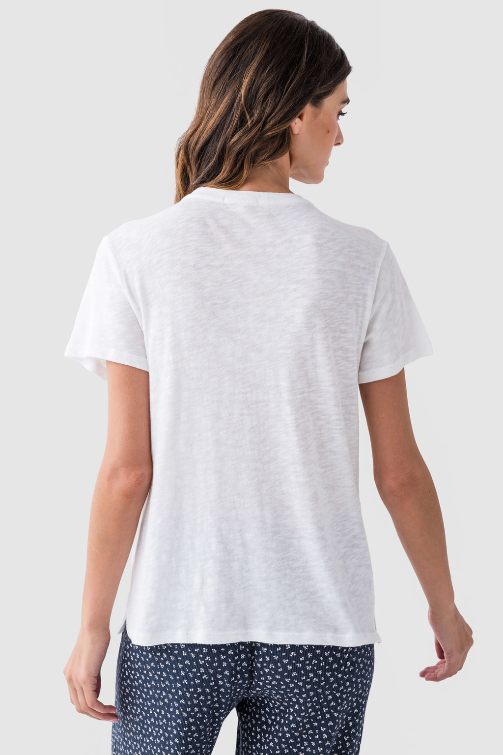 White slub tee shirt back view with crew neck, short sleeves, and straight hem.