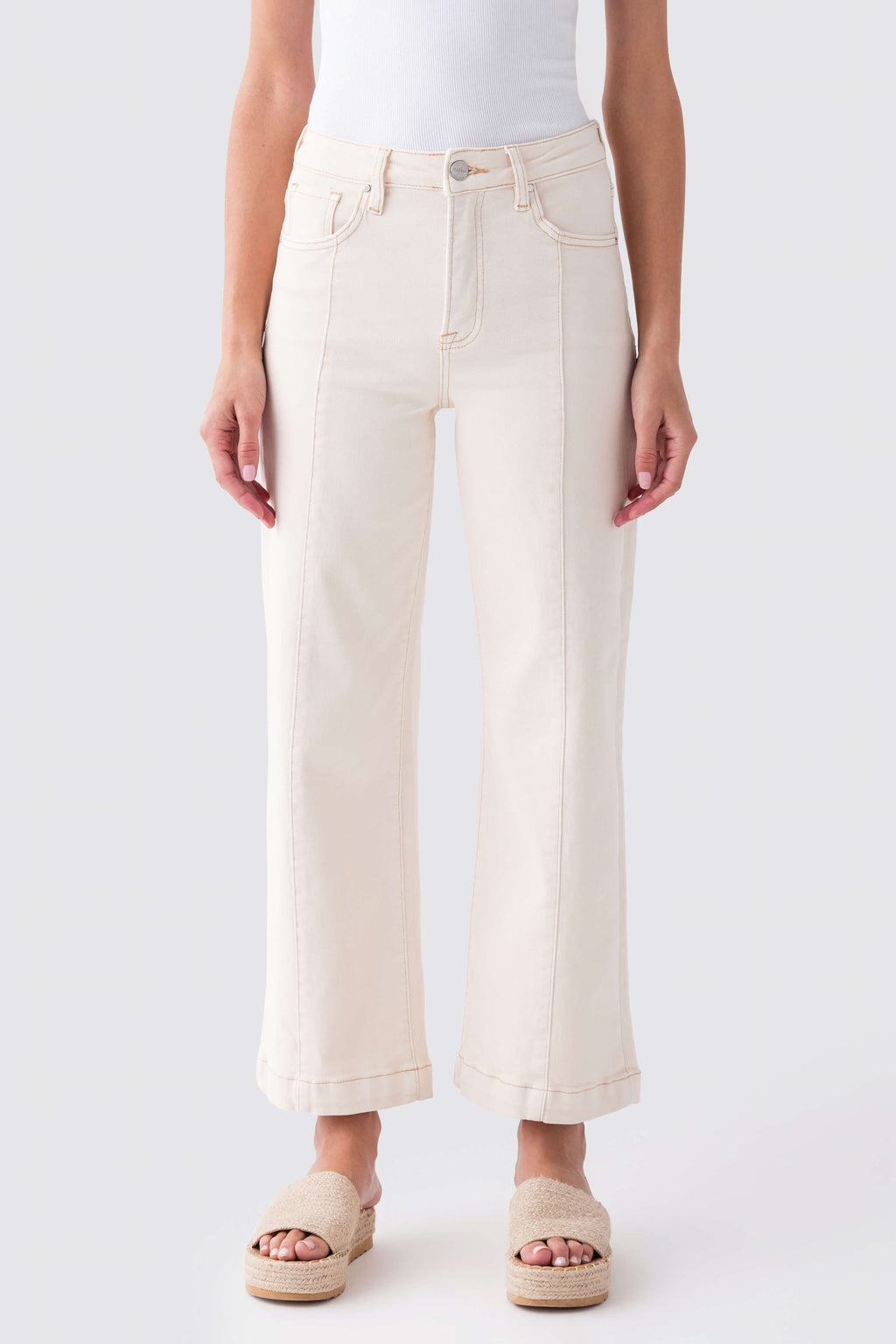 Ivory high-rise wide-leg ankle jeans with button closure, belt loops, and front pockets