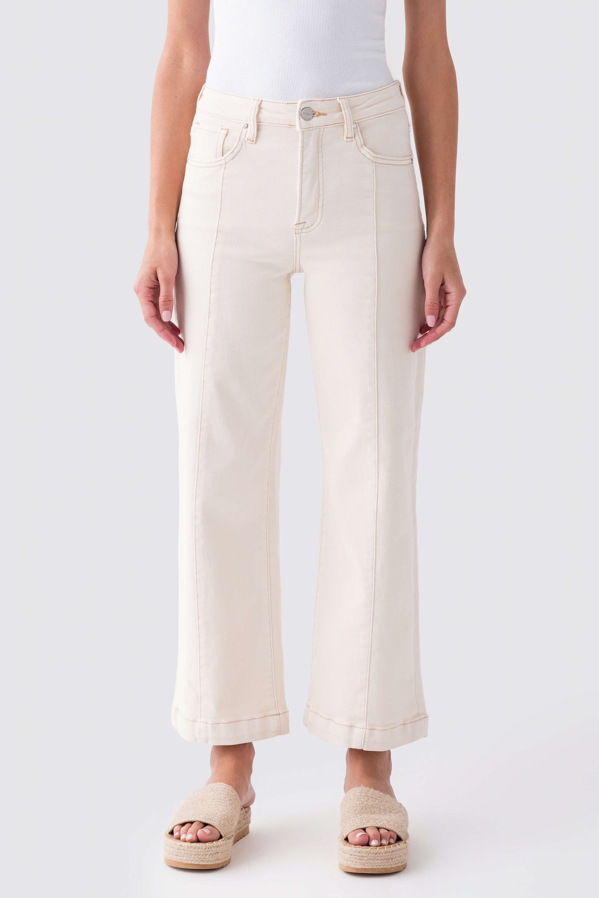Ivory high-rise wide-leg ankle jeans with button closure, belt loops, and front pockets