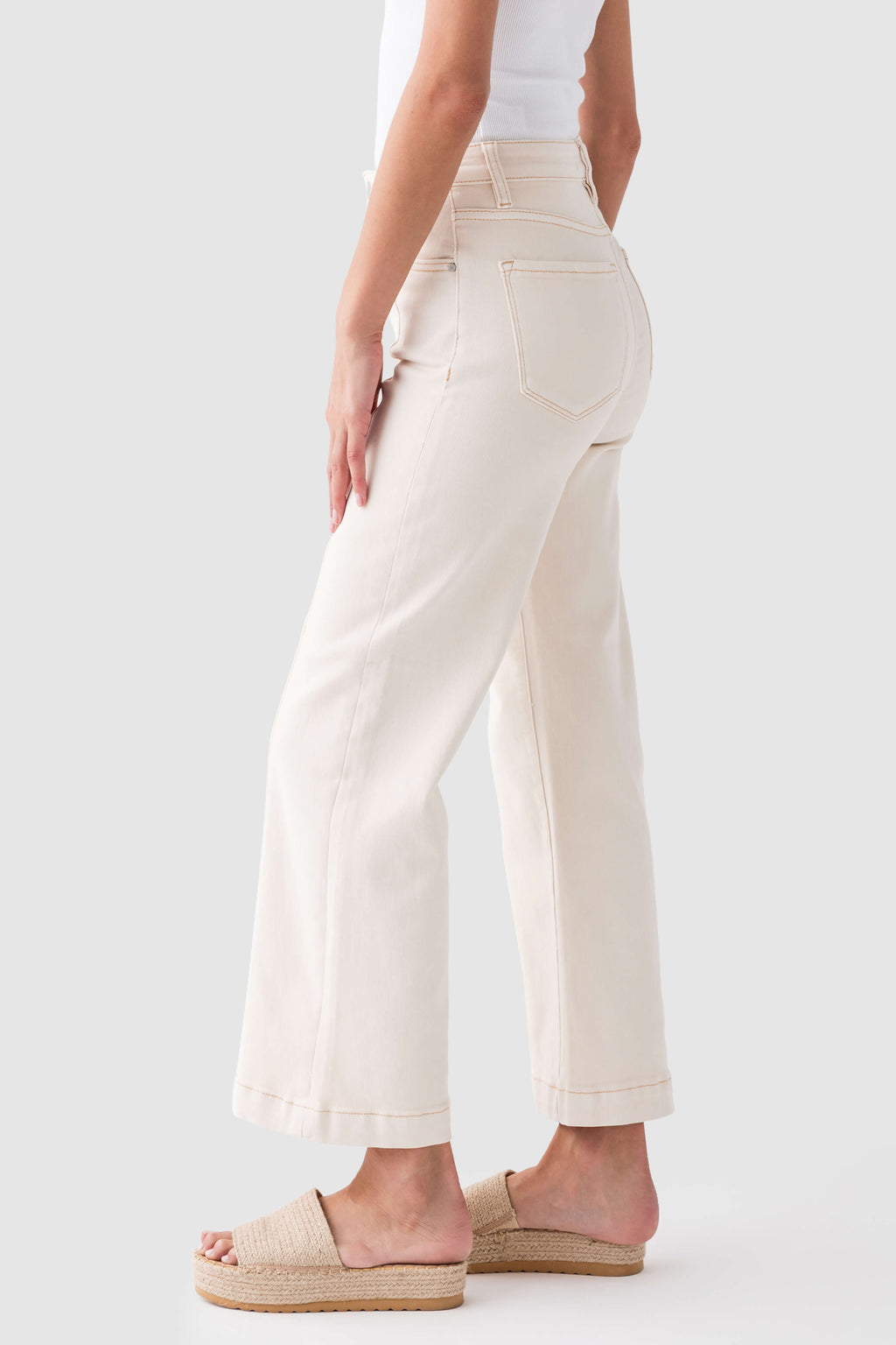 Ivory high-rise wide-leg ankle jeans with front seam and patch pockets