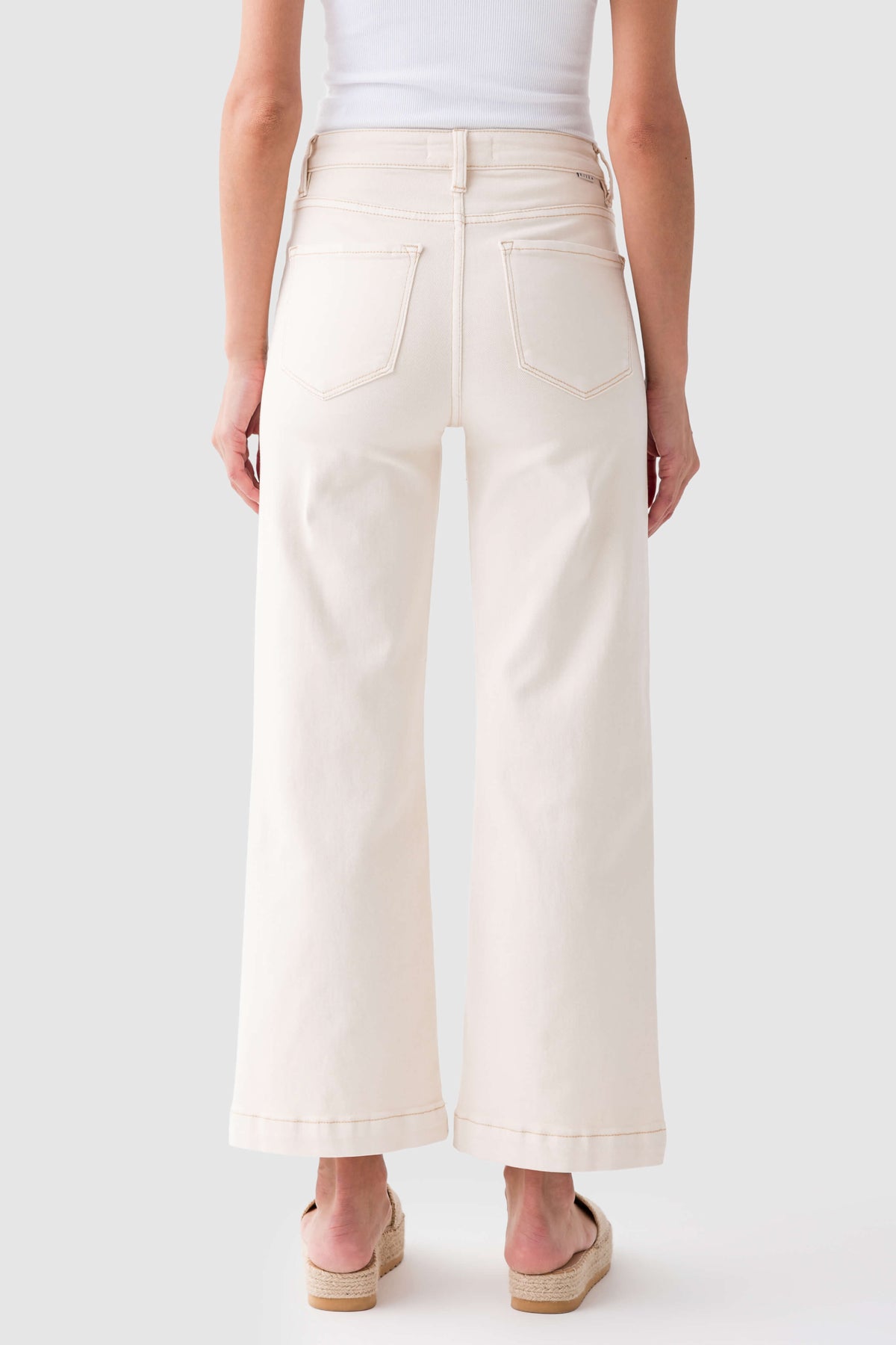 Ivory high-rise wide-leg ankle jeans, back view with belt loops and yoke seams