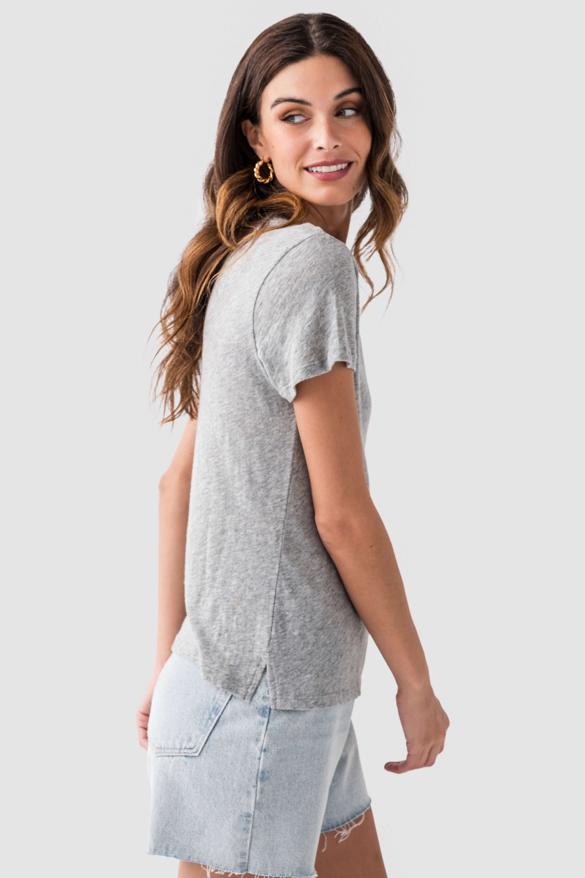 Classic heather grey slub tee shirt with crew neck and short sleeves, side view.