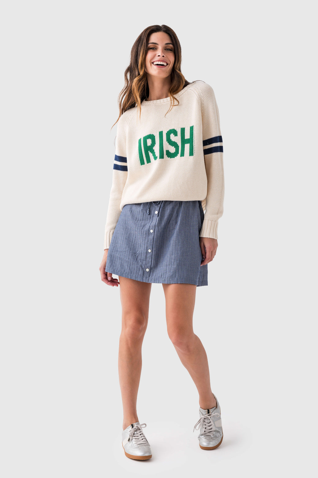 Cream knit sweater with green "IRISH" front graphic and navy sleeve stripes